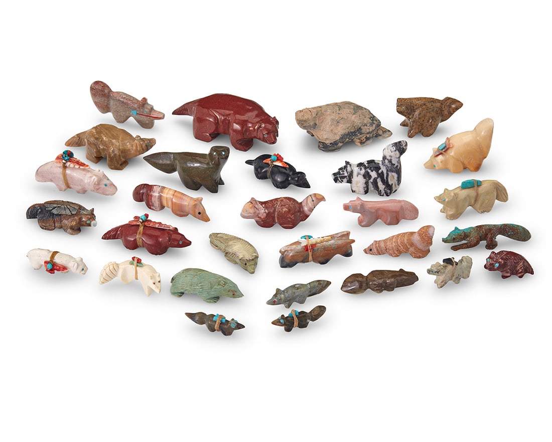 A group of Southwest Pueblo carved stone fox & badger fetish figures Mid/late 20th century, mostly: A group of Southwest Pueblo carved stone fox & badger fetish figuresMid/late 20th century, mostly Zuni PuebloEight labeled for artist; two with unknown marksA group of carved stone figures, including