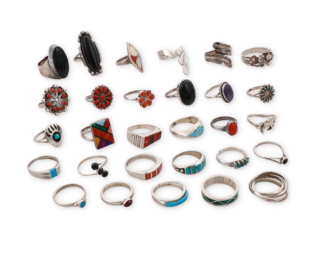 A group of Southwest-style silver and stone set rings: A group of Southwest-style silver and stone set rings Mid/late 20th century Six variously marked for maker including: R. Dishta [for Robert Dista, Zuni] / JD / L / JoAnn Yazzie TK [stylized with