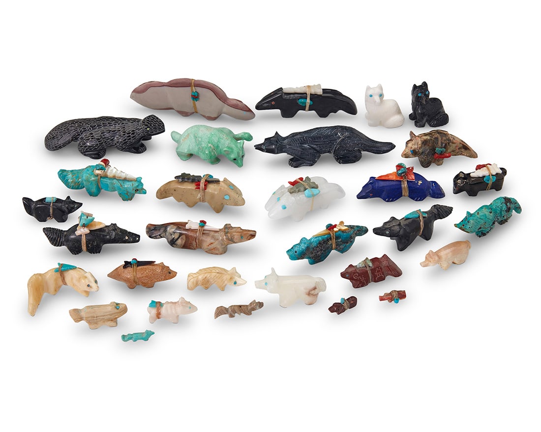 A group of Southwest Pueblo carved stone animal fetish figures: A group of Southwest Pueblo carved stone animal fetish figures Mid/late 20th century, mostly Zuni Pueblo Seven labeled for artist A large group of carved stone animals, including big cats, foxes,