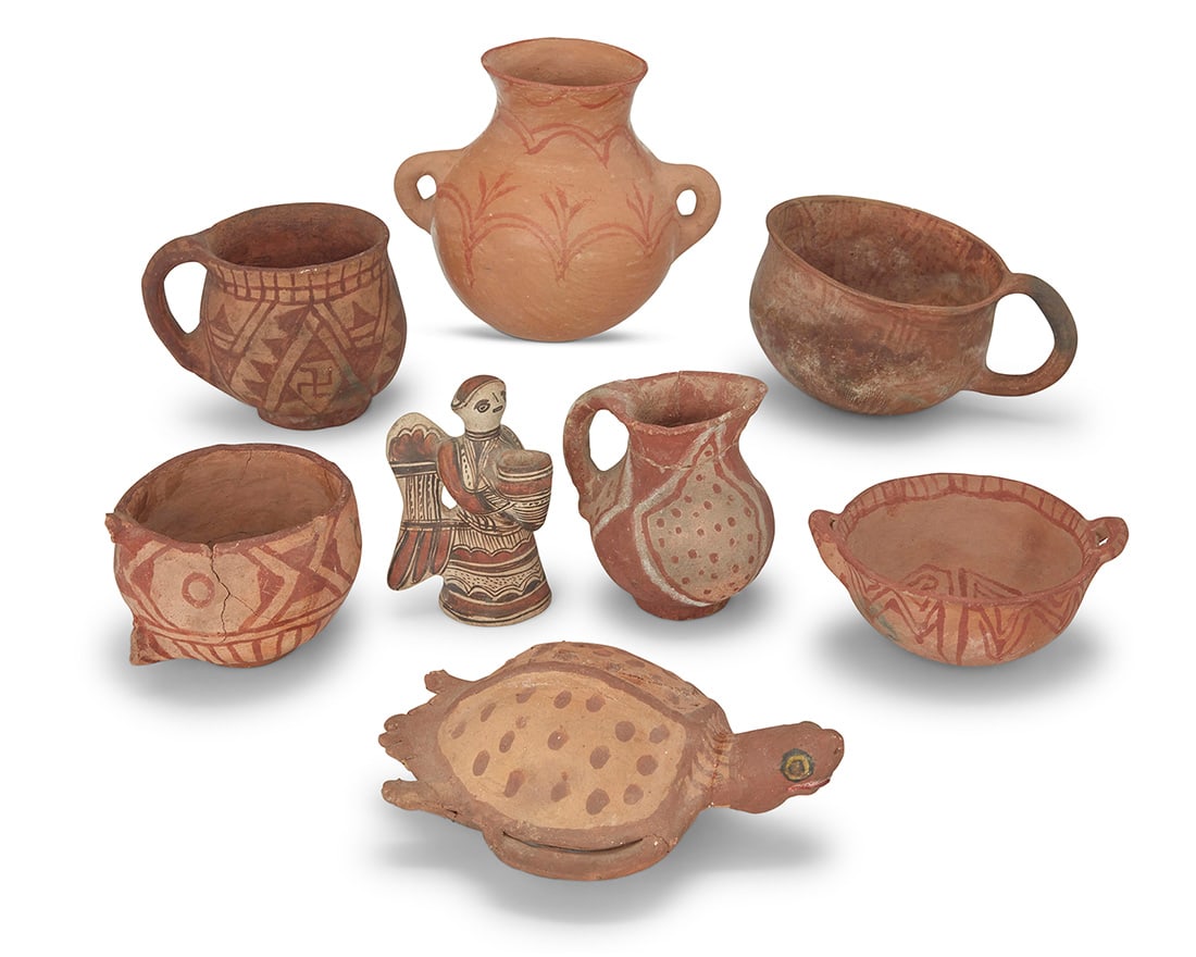 A group of Mojave pottery items Late 19th/early 20th century Comprising three mugs with lug: A group of Mojave pottery itemsLate 19th/early 20th centuryComprising three mugs with lug handles, a handled pitcher, a handled vase decorated with corn stalks, a handled bowl, and a turtle figure, to