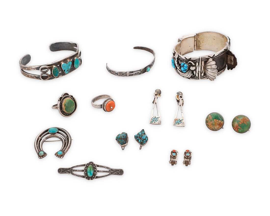 A group of Southwest style sterling silver and set stone jewelry: A group of Southwest style sterling silver and set stone jewelry Mid/late 20th century Most unmarked; coral ring with mid-century Egyptian hallmark Eleven works comprising a Navajo Dine sterling