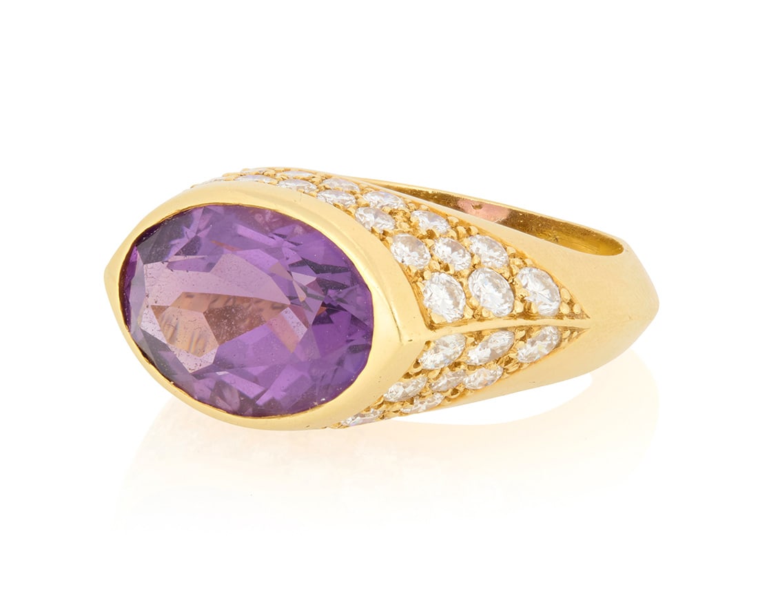 Van Cleef & Arpels: An 18K Gold, Amethyst and Diamond Ring: Van Cleef & Arpels: An 18K Gold, Amethyst and Diamond RingCentering an oval amethyst weighing approximately 5.25 carats, accented by round diamonds weighing approximately 2.30 carats, signed VCA, 5H22