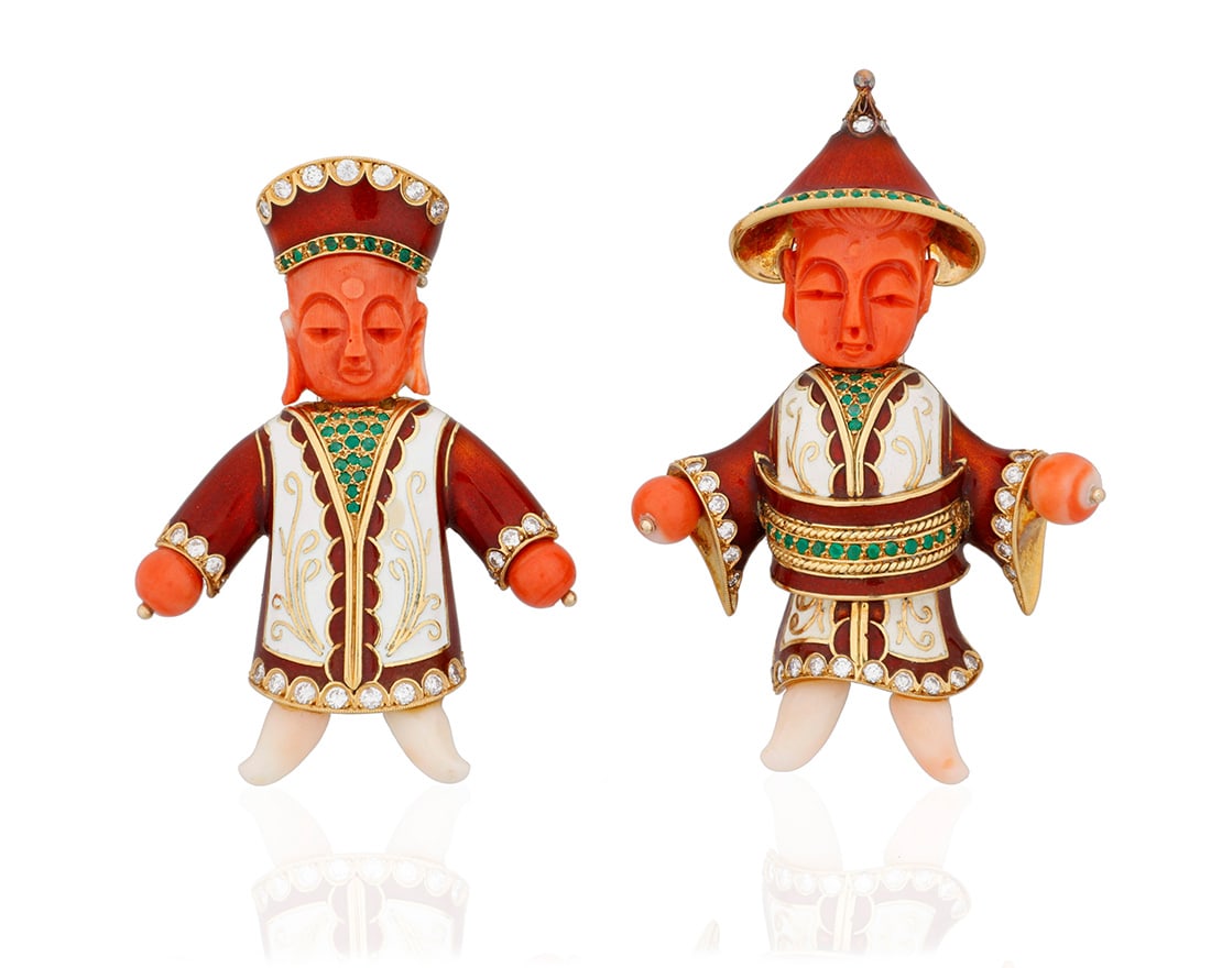 A Pair of 18K Gold, Coral and Enamel Brooches: A Pair of 18K Gold, Coral and Enamel BroochesIncluding two carved coral figural designs featuring garments of red and white enamel accented by round diamonds and emeralds, with makers mark B2 piecesMe