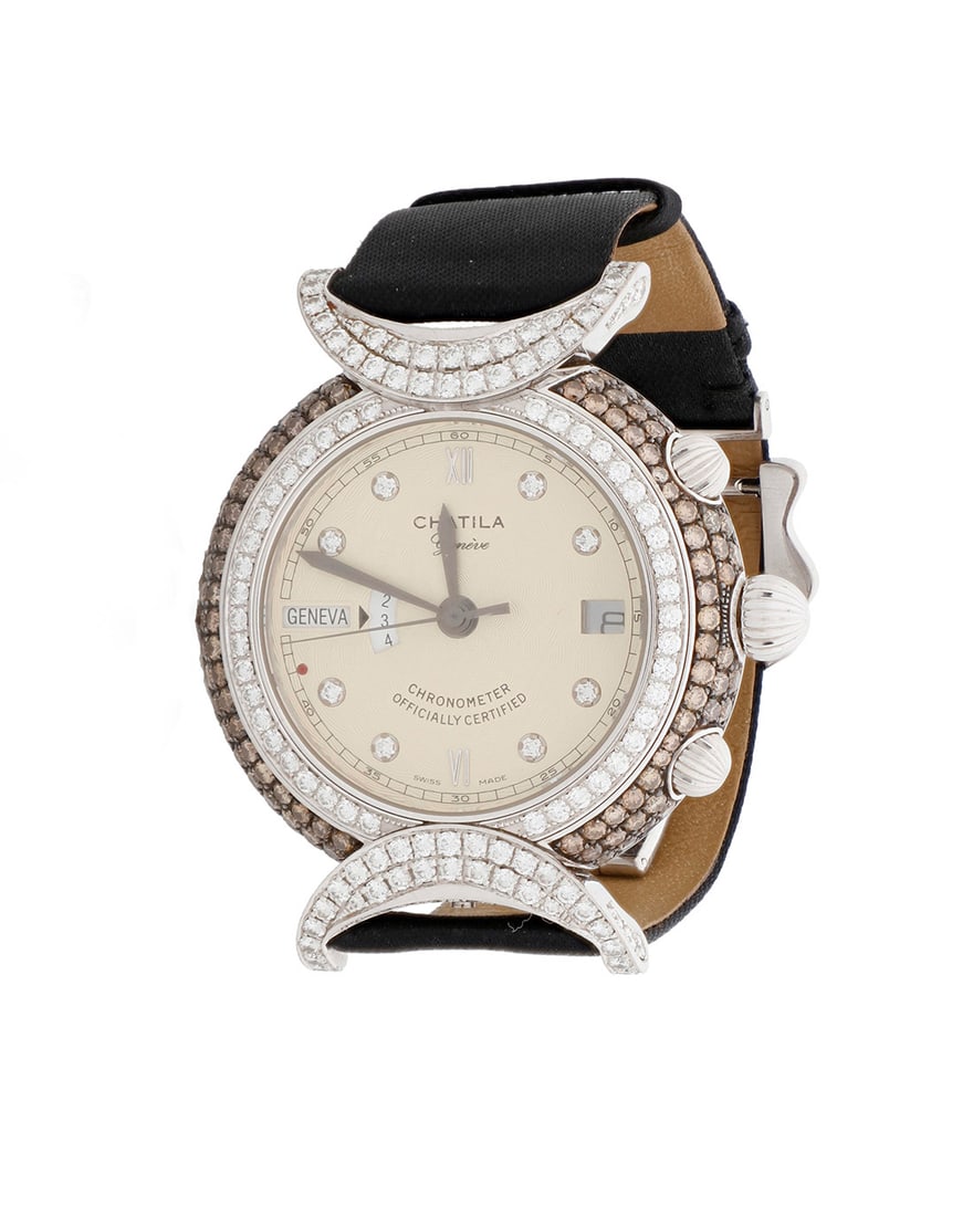 Chatila: An 18K White Gold, Diamond and Colored Diamond Watch: Chatila: An 18K White Gold, Diamond and Colored Diamond WatchDial: 30.00 mm, round with diamond set hour markers, encircled by round brown and near-colorless diamonds weighing approximately 4.70 carat