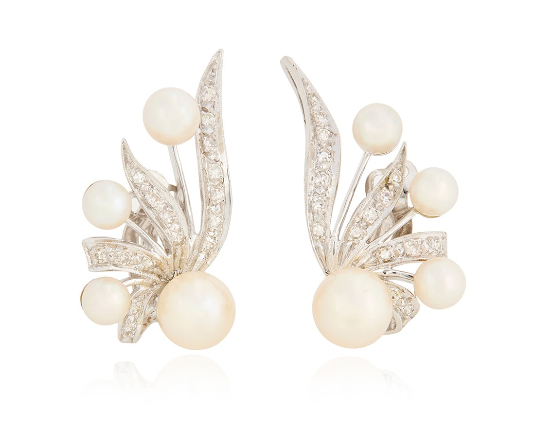 A Pair of 14K White Gold, Cultured Pearl and Diamond Earclips: A Pair of 14K White Gold, Cultured Pearl and Diamond EarclipsOf a spray design featuring cultured pearls and single-cut diamonds weighing approximately 0.64 carat2 piecesMeasures: 1 x 3/4 in.9.5 grams