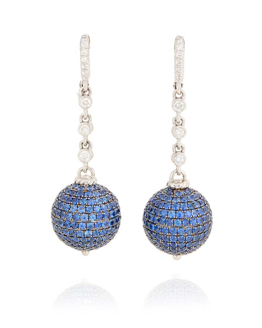 A Pair of 18K White Gold, Sapphire and Diamond Earrings: A Pair of 18K White Gold, Sapphire and Diamond EarringsSuspending two spheres set with rows of round sapphires accented by a diamond chain set with round diamonds weighing approximately 0.45 carat tot