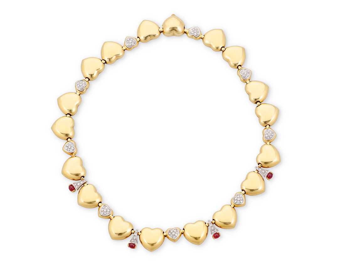An 18K Gold, Ruby and Diamond Heart Necklace: An 18K Gold, Ruby and Diamond Heart Necklace Featuring high polish heart-shaped links accented by heart-shaped connectors set with round diamonds weighing approximately 2.00 carats, finished with