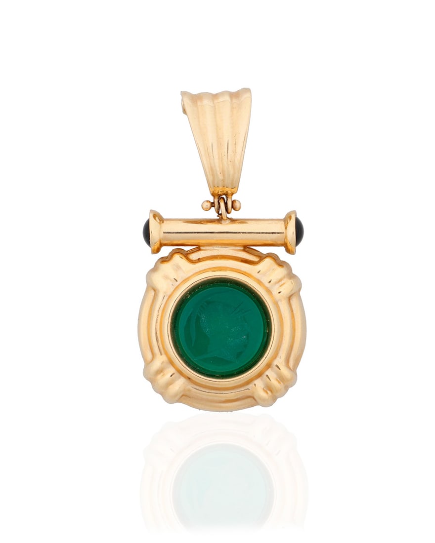 A 14K Gold and Intaglio Pendant: A 14K Gold and Intaglio Pendant Featuring a round dyed green chalcedony intaglio, accented by two round onyx cabochons set in a stepped design Measures: 1 1/2 x 3/4 in. 6.7 grams Provenance: The