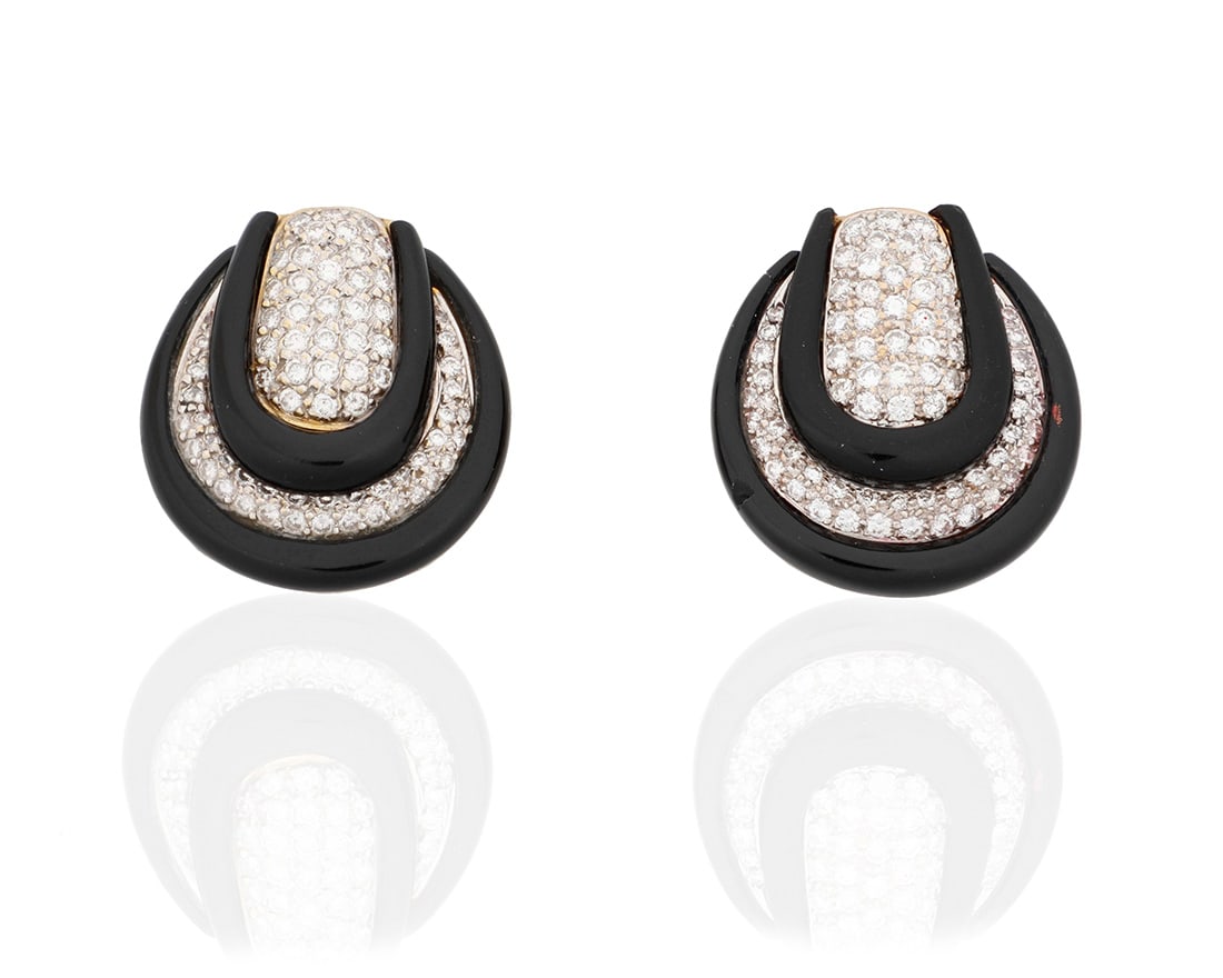 A Pair of 18K Gold, Onyx and Diamond Earclips: A Pair of 18K Gold, Onyx and Diamond EarclipsOf a geometric design featuring carved onyx and pave-set diamonds weighing approximately 3.75 carats2 piecesMeasures: 1 1/4 x 1 in.28.6 grams grossPro