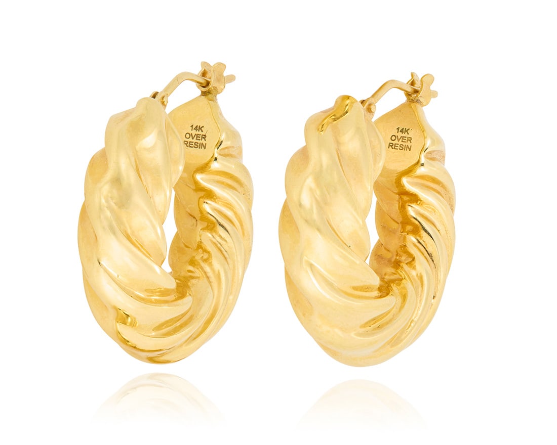 A Pair of 14K Gold Hoop Earrings: A Pair of 14K Gold Hoop EarringsOf a twisted hoop design, stamped 14k over resin2 piecesMeasures: 1 in.5.7 grams grossProvenance:The Estate of Joanna Carson