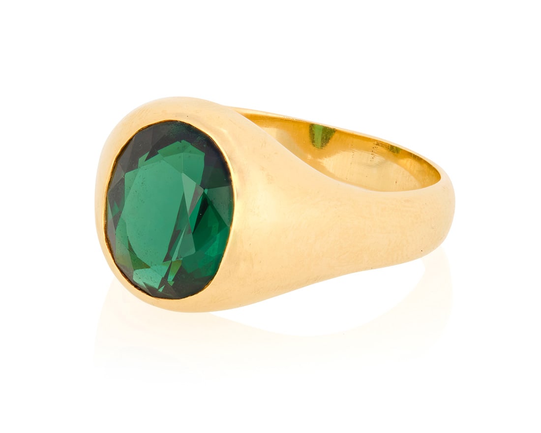 A 14K Gold and Green Tourmaline Ring: A 14K Gold and Green Tourmaline RingOf a signet design centering an oval green tourmaline weighing approximately 4.12 caratsSize: 10 3/411.4 grams grossProvenance:The Estate of Joanna Carson