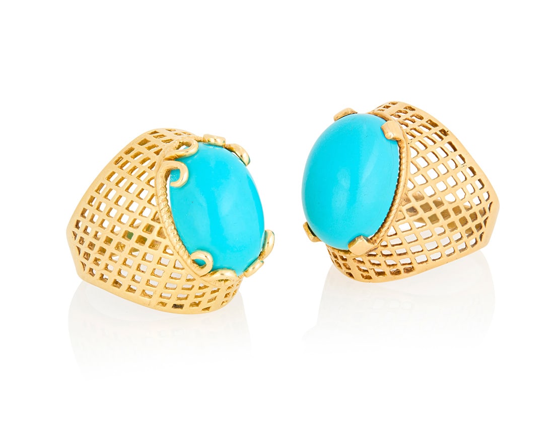 A Pair of 14K Gold and Composite Turquoise Rings: A Pair of 14K Gold and Composite Turquoise RingsCentering two oval composite turquoise cabochons set in an open lattice work designSize: 8 and 8 1/218.2 grams grossProvenance:The Estate of Joanna