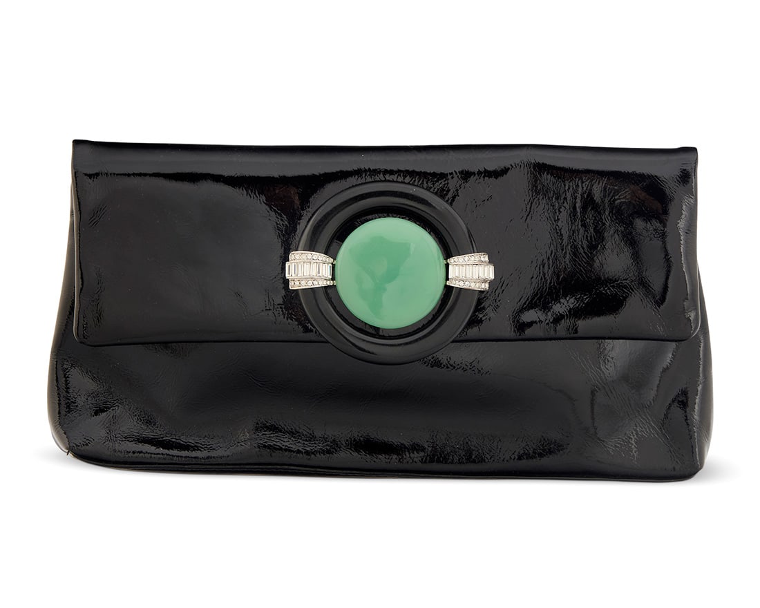 Kenneth Jay Lane: A Vintage Black Patent Leather Clutch: Kenneth Jay Lane: A Vintage Black Patent Leather ClutchSigned to interior plaque: Kenneth J. LaneA narrow envelope clutch bag with green and black Art Deco-style resin magnetic clasp with diamonte acc