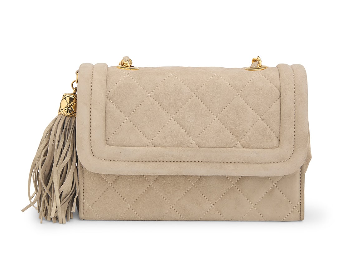 CHANEL: A Vintage Quilted CC Grey Suede Mini Flap Bag: CHANEL: A Vintage Quilted CC Grey Suede Mini Flap BagCirca 1980s; ItalyStamped to interior: Chanel / ® / Made in ItalyA vintage Lagerfeld rectangular suede leather Boy-style crossbody flap bag, the f