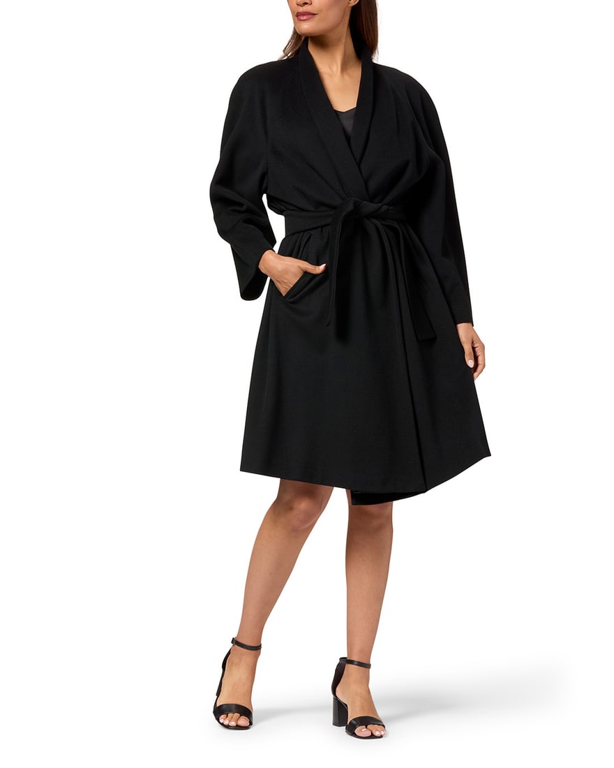 Fendi: A Black Wool '365' Swing Coat: Fendi: A Black Wool '365' Swing CoatCirca 1980s-1990s, ItalyLabel: Fendi / 365 / Made in Italy; material tag: 50% wool, 25% cashmere, 25% lambswoolA smooth wool-mix wrap coat with deep raglan sleeves,