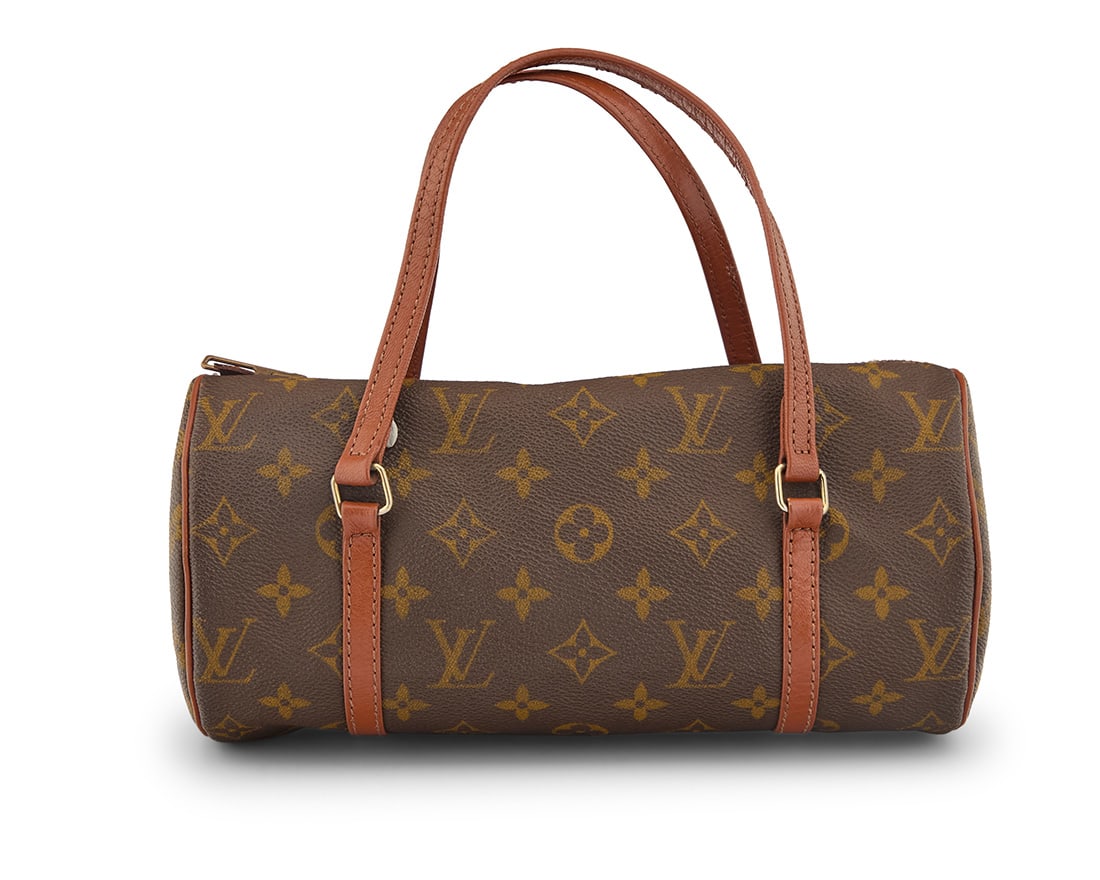 Louis Vuitton: A Vintage Monogram Canvas Papillon 26 Bag: Louis Vuitton: A Vintage Monogram Canvas Papillon 26 BagCirca 1970s-1980sThe LV canvas small barrel bag with dual classic russet orange leather handles, zip top closure with Eclair zipper, and with pa