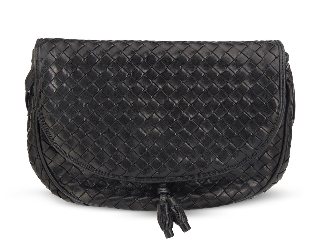 Bottega Veneta: A Vintage Black Intrecciato Woven Leather Shoulder Bag: Bottega Veneta: A Vintage Black Intrecciato Woven Leather Shoulder BagMarked to interior plaque: Bottega Veneta / Made in ItalyA rounded double flap crossbody bag with woven leather exterior, press-st