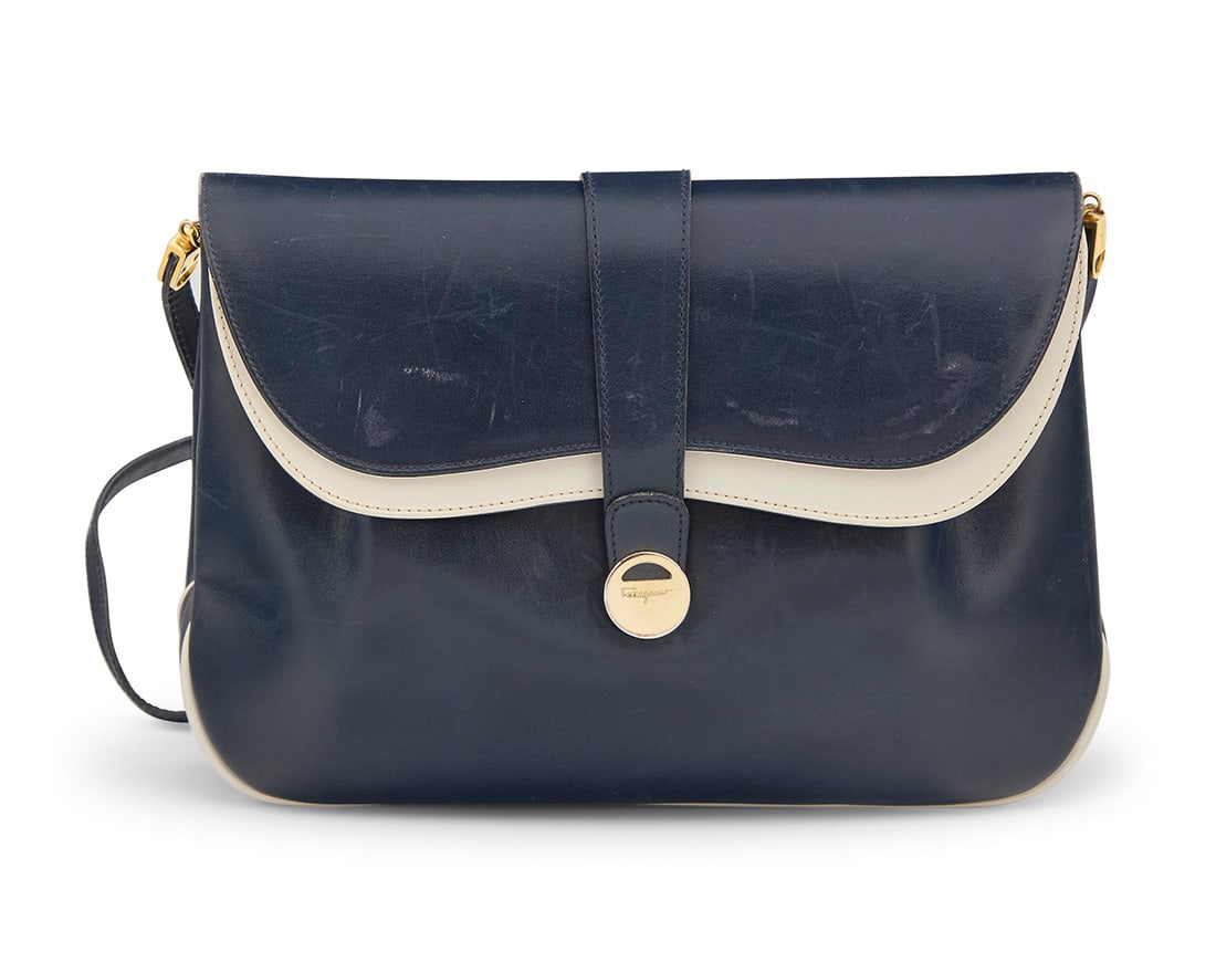 Ferragamo: A Vintage Navy & White Leather Shoulder Bag: Ferragamo: A Vintage Navy & White Leather Shoulder BagMarked to interior: Salvatore Ferragamo / Made in Italy / Firenze 17A navy double flap shoulder bag clutch with contrast white leather details, pl