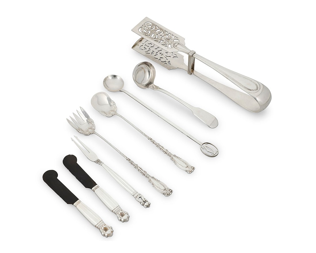 A group of silver serving utensils (1 of 3)