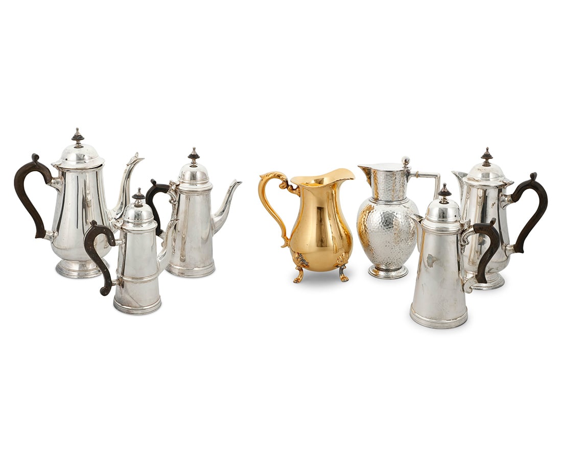 A group of silver plated coffee pots and a sterling silver pitcher: A group of silver plated coffee pots and a sterling silver pitcher20th centuryFive with unknown maker's mark: SM [conjoined, in a triangle] / EPNS; the hammered pitcher with Danish hallmarks and: A.Dr