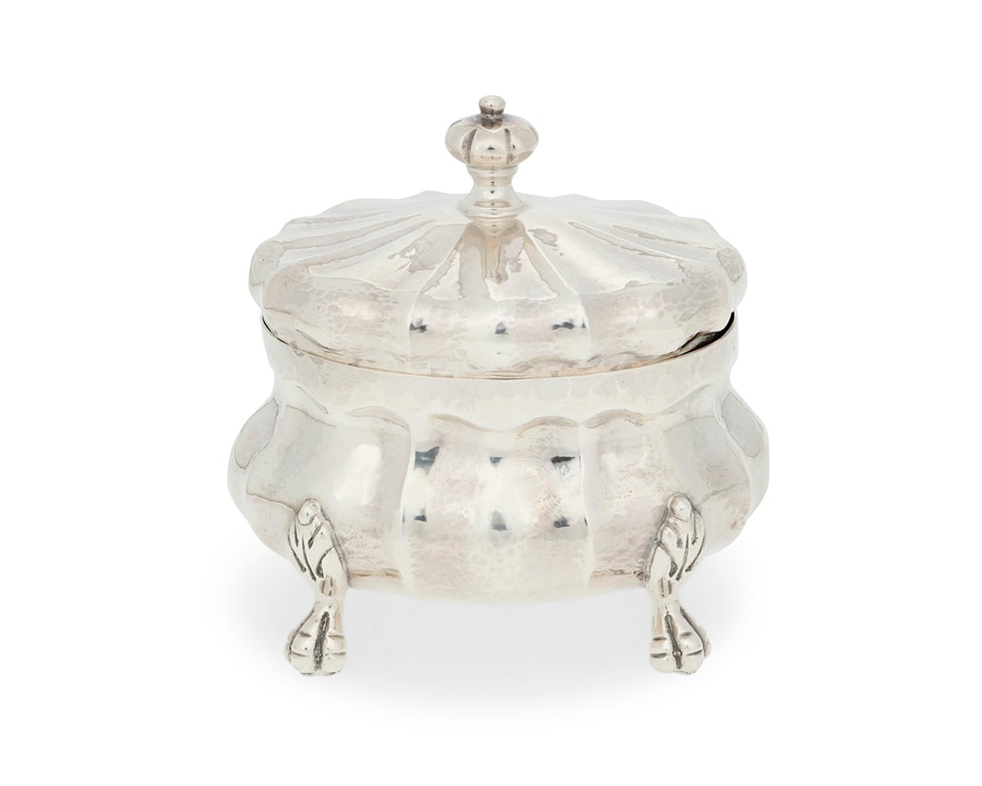 A Buccellati sterling silver covered box: A Buccellati sterling silver covered boxMid-20th centuryImpressed: ITALY / BUCCELLATI / STERLINGThe hinged domed lid over the bombe body raised on animal paw feet3.5" H x 3.5" W x 2.75" D5.5 oz. troy