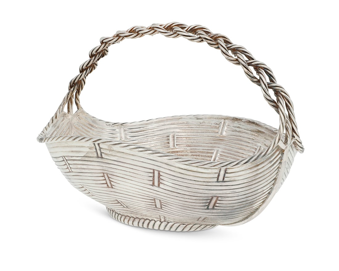 A Fratelli Cacchione for Cartier sterling silver basket: A Fratelli Cacchione for Cartier sterling silver basket Mid-20th century Marked: Cartier / FC / 925 / ITALY / STERLING The pseudo wicker oval basket with braided handle 7.75" H x 11.125" W 38.3 oz.