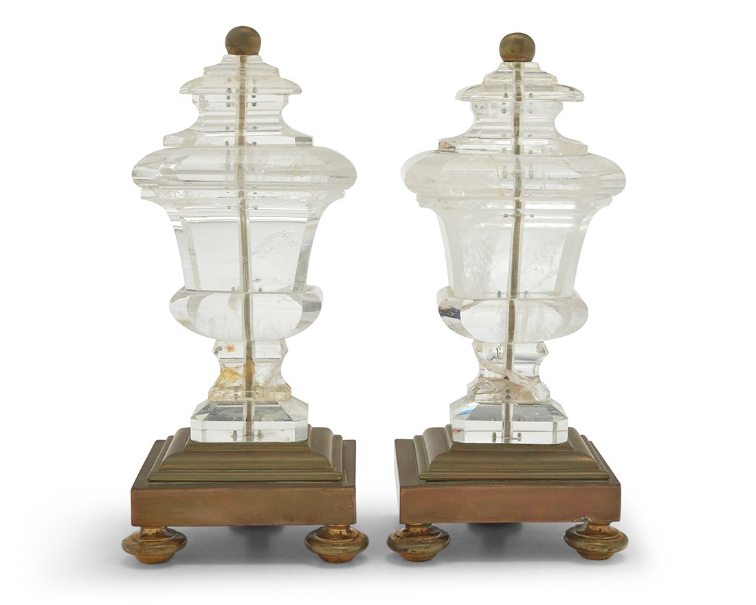 A pair of rock crystal ornaments: A pair of rock crystal ornaments 20th century Each mounted on a brass tiered base with three feet 2 pieces Each: 10.875" H x 5" W x 4.125" D Provenance: The Estate of Joanna Carson