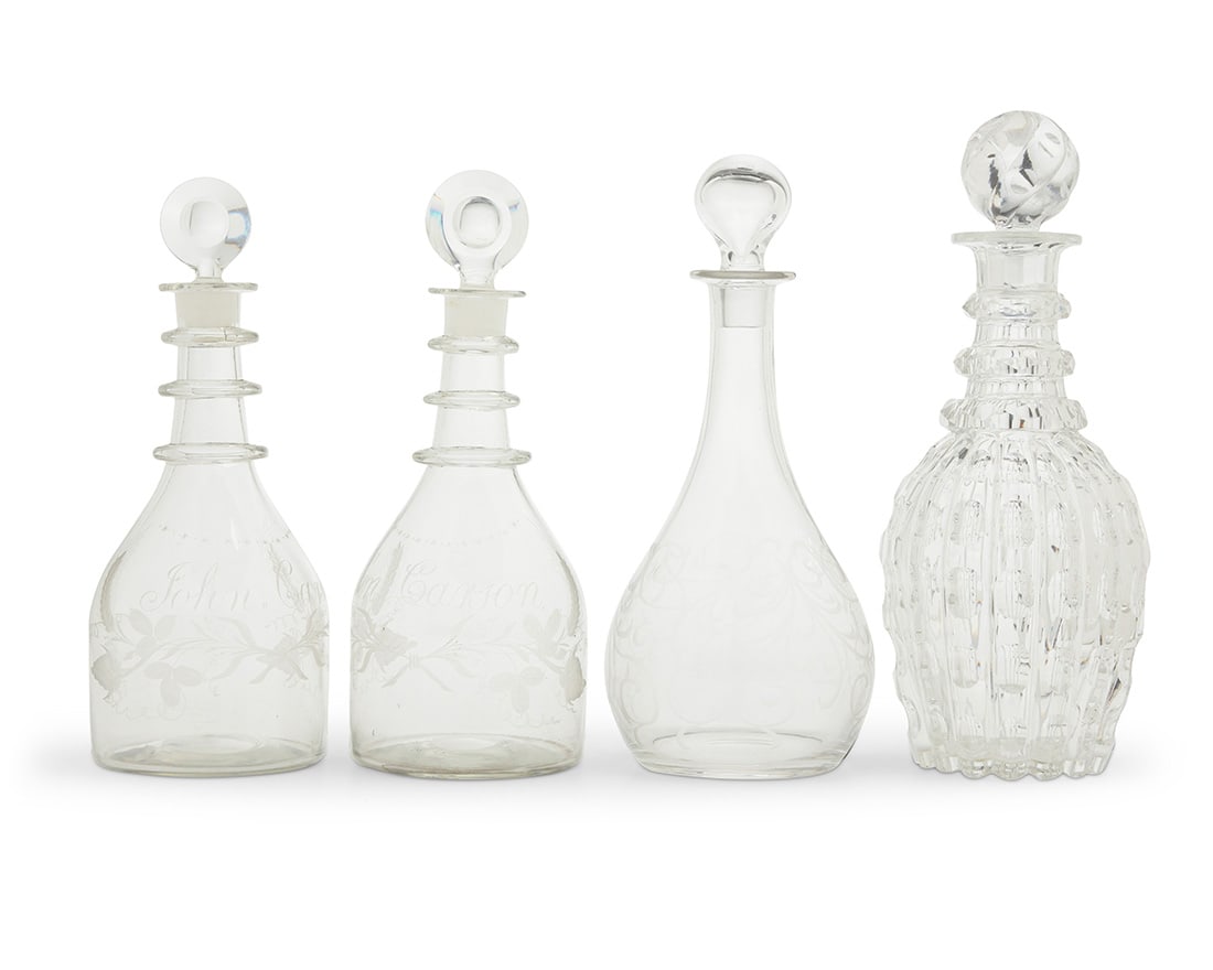 A group of four clear glass decanters (1 of 4)