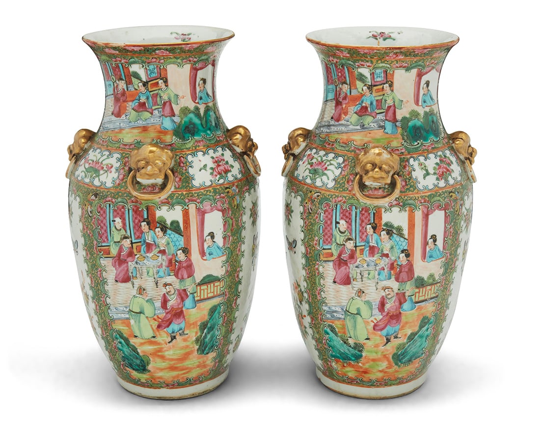 A pair of Chinese Export Rose Medallion porcelain vases: A pair of Chinese Export Rose Medallion porcelain vases20th centuryUnmarkedEach with four gilt lion-form ring handles to shoulder, painted with alternating friezes of courtly figures and birds with bu