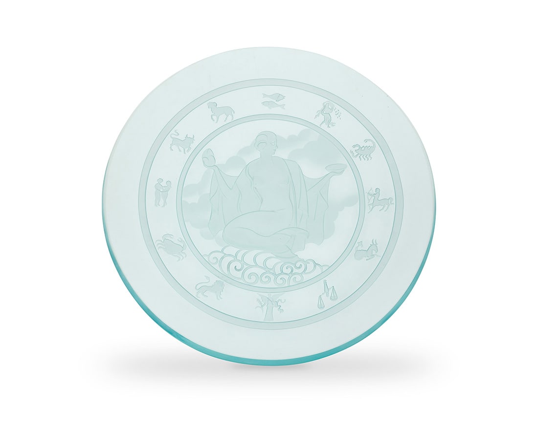 An Art Deco-style etched glass charger: An Art Deco-style etched glass chargerLate 20th centuryUnmarkedPossibly depicting Aphrodite at center, bordered by zodiac figures2.125" H x 22" Dia. Provenance:The Estate of Joanna Carson