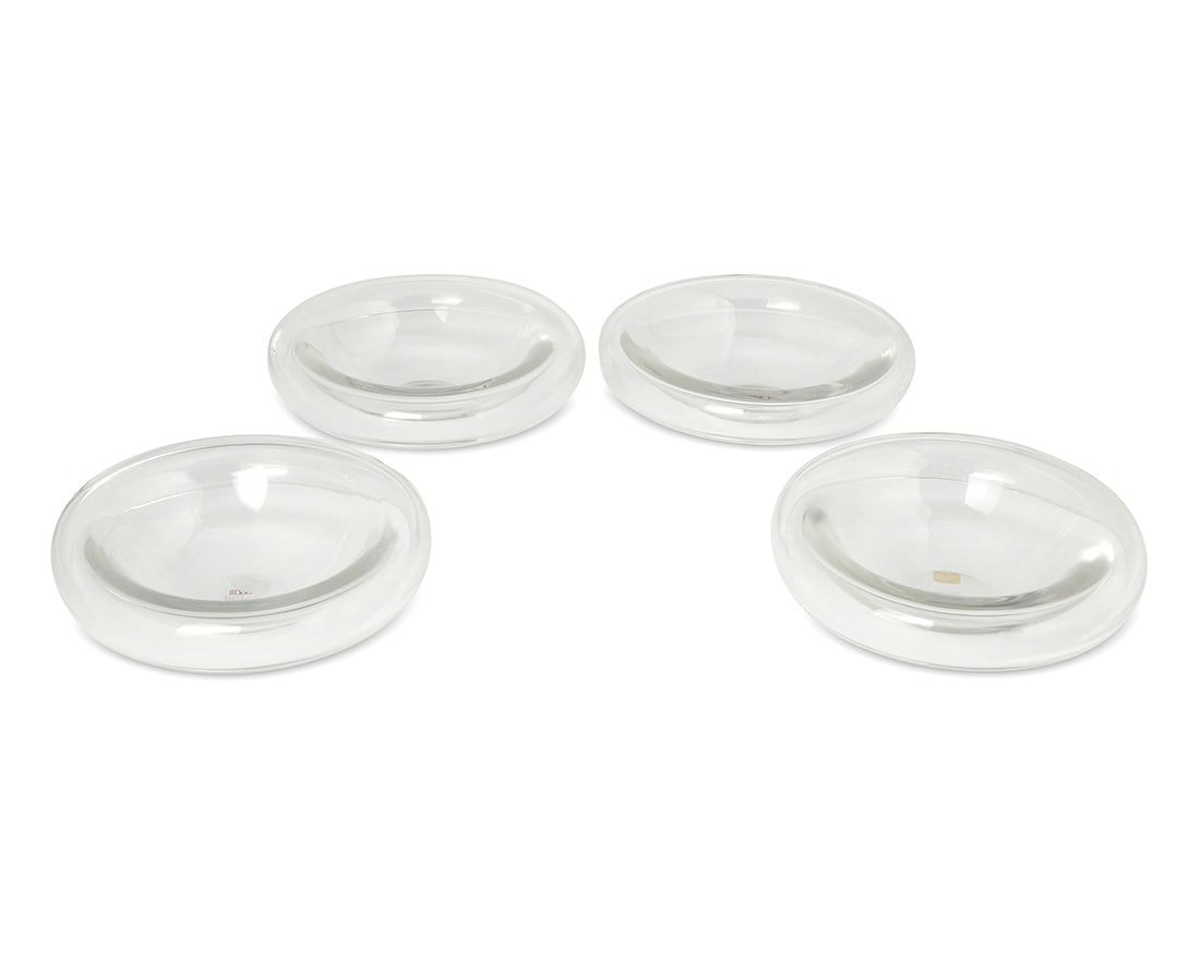 A set of four Oggetti glass bowls: A set of four Oggetti glass bowlsLate 20th centuryEach with two applied labels: Oggetti / Miami / Made in Italy / Marshall Todd's / The Glass Menagerie / Beverly Hills4 piecesEach: 2.75" H x 9.125" Di