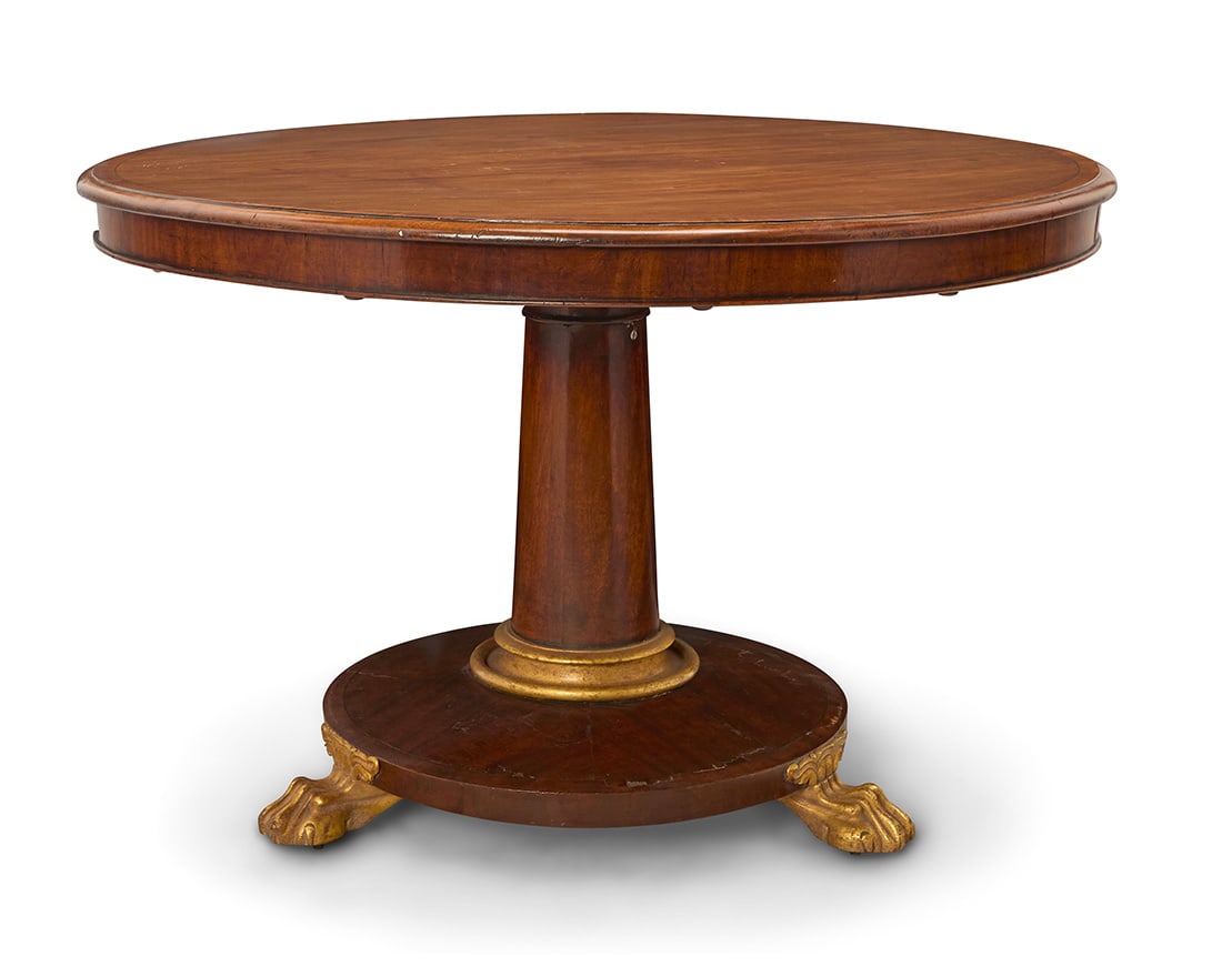 A William IV mahogany tilt top breakfast table: A William IV mahogany tilt top breakfast tableCirca 1830The pedestal support with later gilding to base and three paw feetOpen: 31.25" H x 47.75" Dia.; Stored: 60.75" H Provenance:The Estate of Joanna