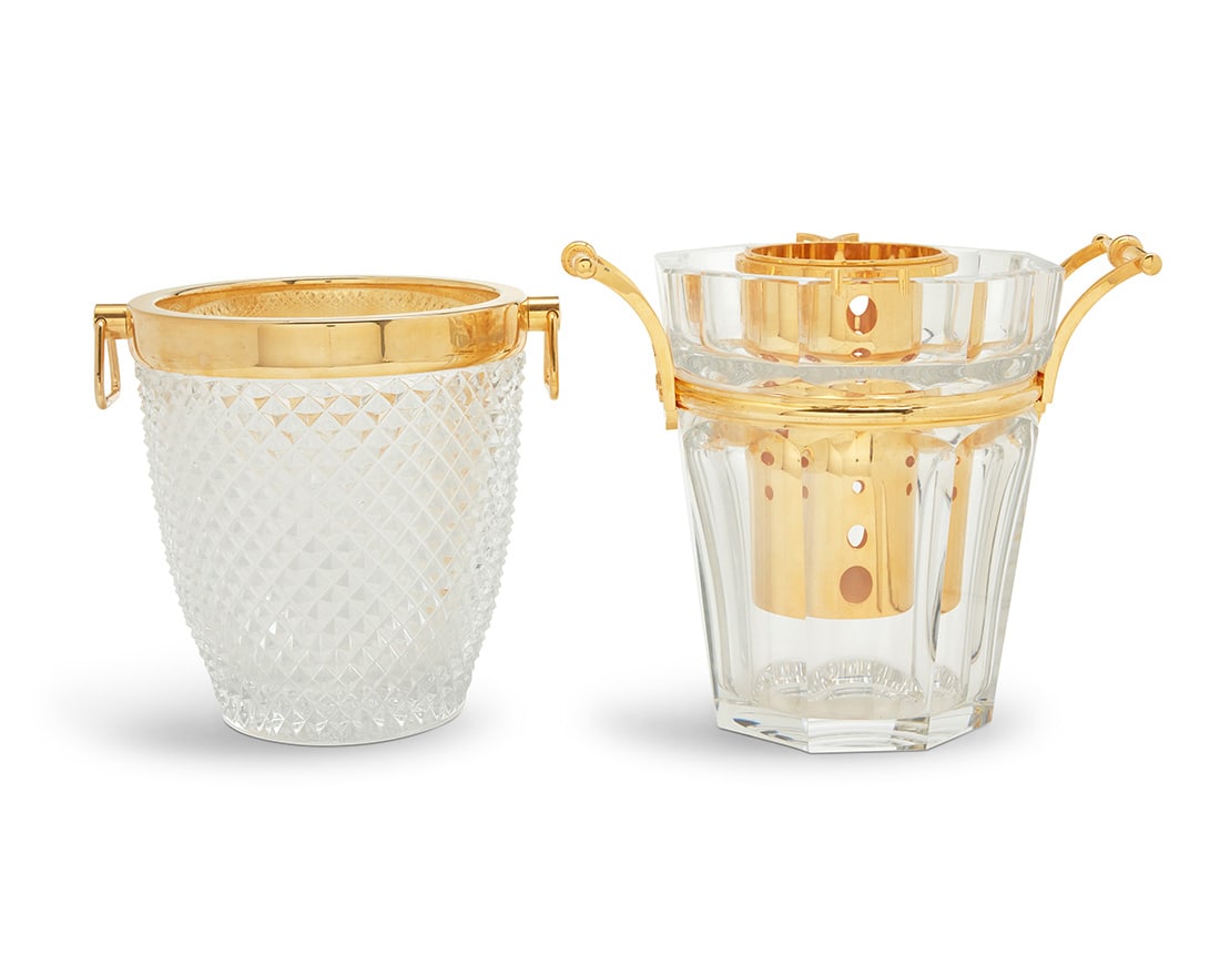 Two French glass and gilt metal champagne buckets: Two French glass and gilt metal champagne bucketsLate 20th centuryThe lobed with Baccarat etched factory mark, the other unmarkedEach with gilt metal handles, comprising one Baccarat 'Harcourt' bucket