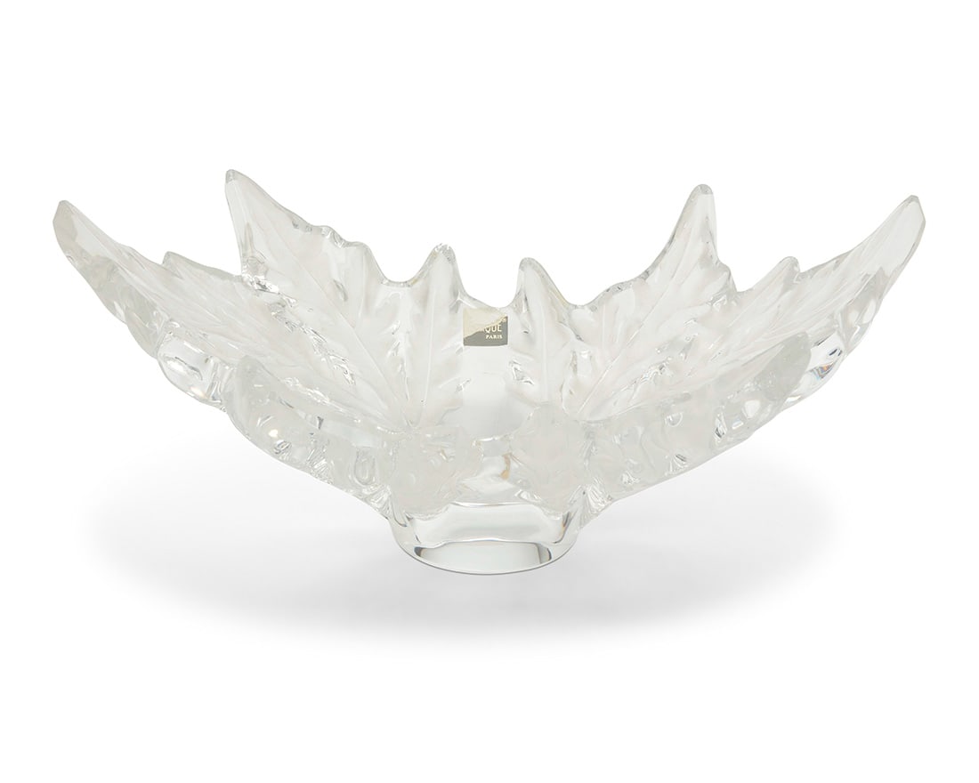 A Lalique glass 'Champs Elysees' centerpiece bowl: A Lalique glass 'Champs Elysees' centerpiece bowlLate 20th/early 21st centuryEtched: Lalique ® / France; with partial factory label7.75" H x 18" W x 10.125" D Provenance:The Estate of Joanna Carson