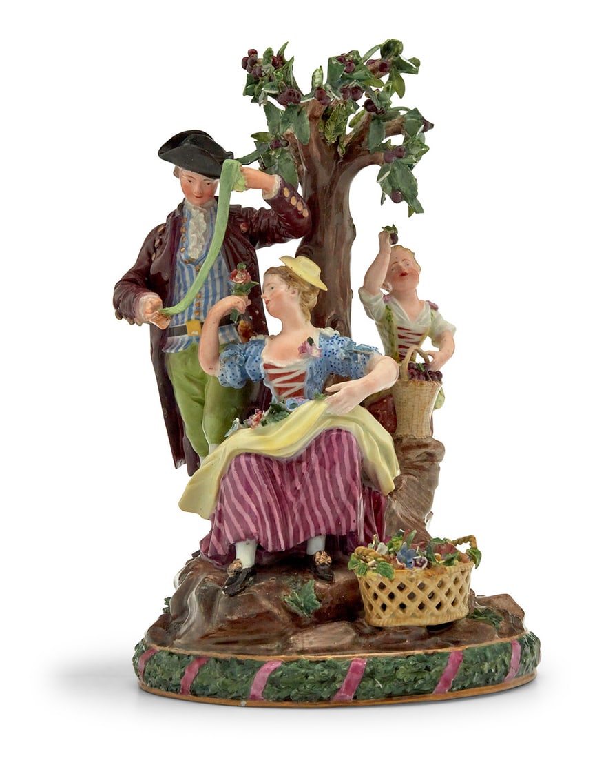 A Meissen porcelain group of apple pickers: A Meissen porcelain group of apple pickers Late 19th/early 20th century, after a design by Johann Joachim Kaendler and Friedrich Elias Meyer With underglaze blue crossed swords 10.25" H x 6.25" W x