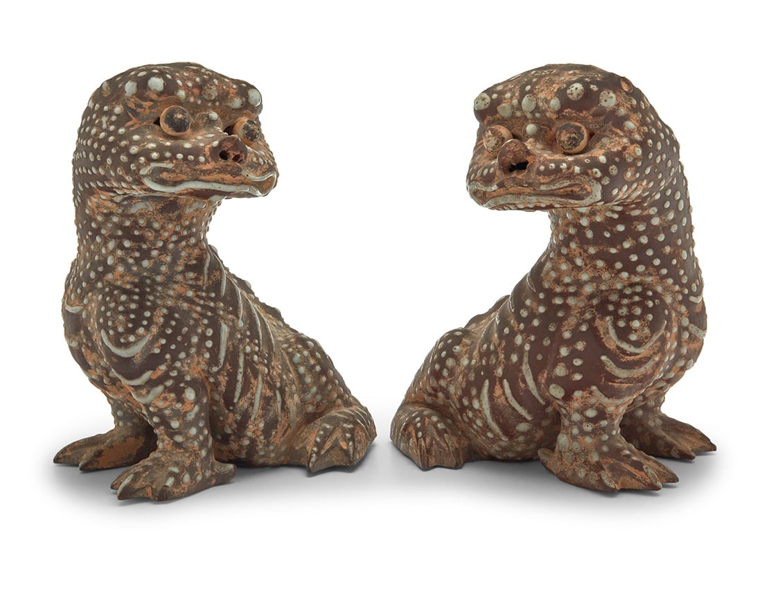 Two Chinese pottery figures of mythical beasts: Two Chinese pottery figures of mythical beastsCirca 1900Each with three-legged toad-like bodies and Qilin heads, decorated with beads of enamel2 piecesEach: 9" H x 8" W x 7.25" D