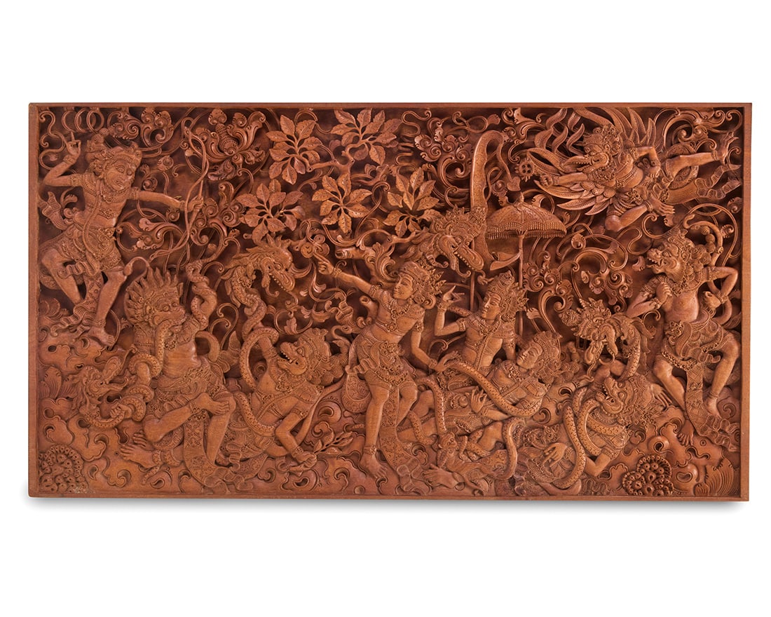 A Southeast Asian carved teakwood panel: A Southeast Asian carved teakwood panel 20th century Incised verso: [indecipherable] / HOTEL MUTIARA / UBUD BALI Thai or Indonesian, depicting a scene from the Hindu epic the Ramayana 24.25" H x