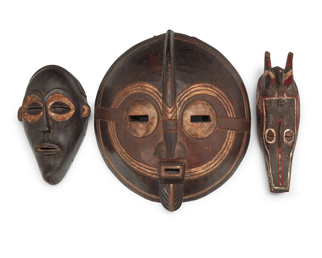 Three African carved wood masks (1 of 2)