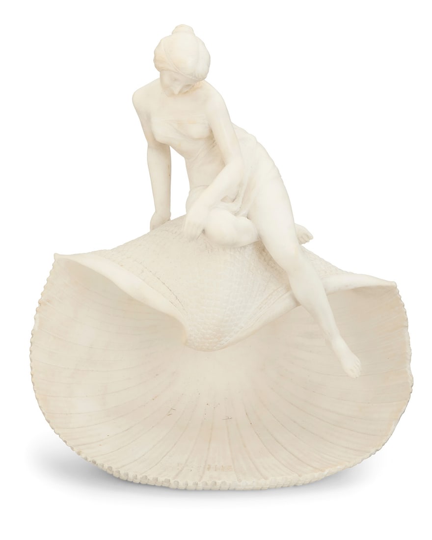 Pietro Emilio Fiaschi (1858-1941), An Italian carved marble nude maiden on a shell, early 20th: Pietro Emilio Fiaschi (1858-1941) An Italian carved marble nude maiden on a shell, early 20th century Incised to underside: P. C. E. Fiaschi / Firenze / made in Italy 16.25" H x 14.25" W x 8.75" D