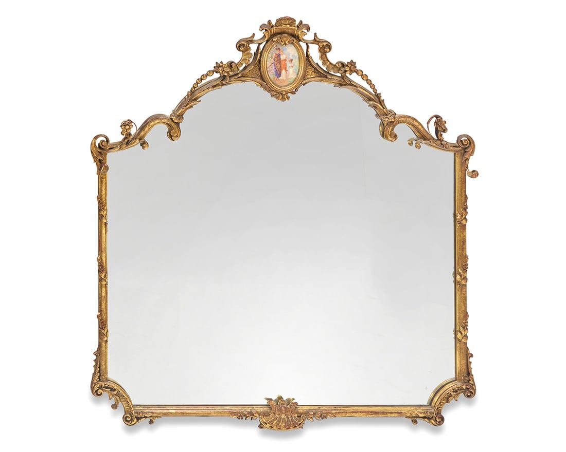 A Rococo style giltwood mirror: A Rococo style giltwood mirror 19th/20th century The crest centered by a painted ceramic panel depicting three maidens Overall: 42.25" H x 39.5" W x 4" D