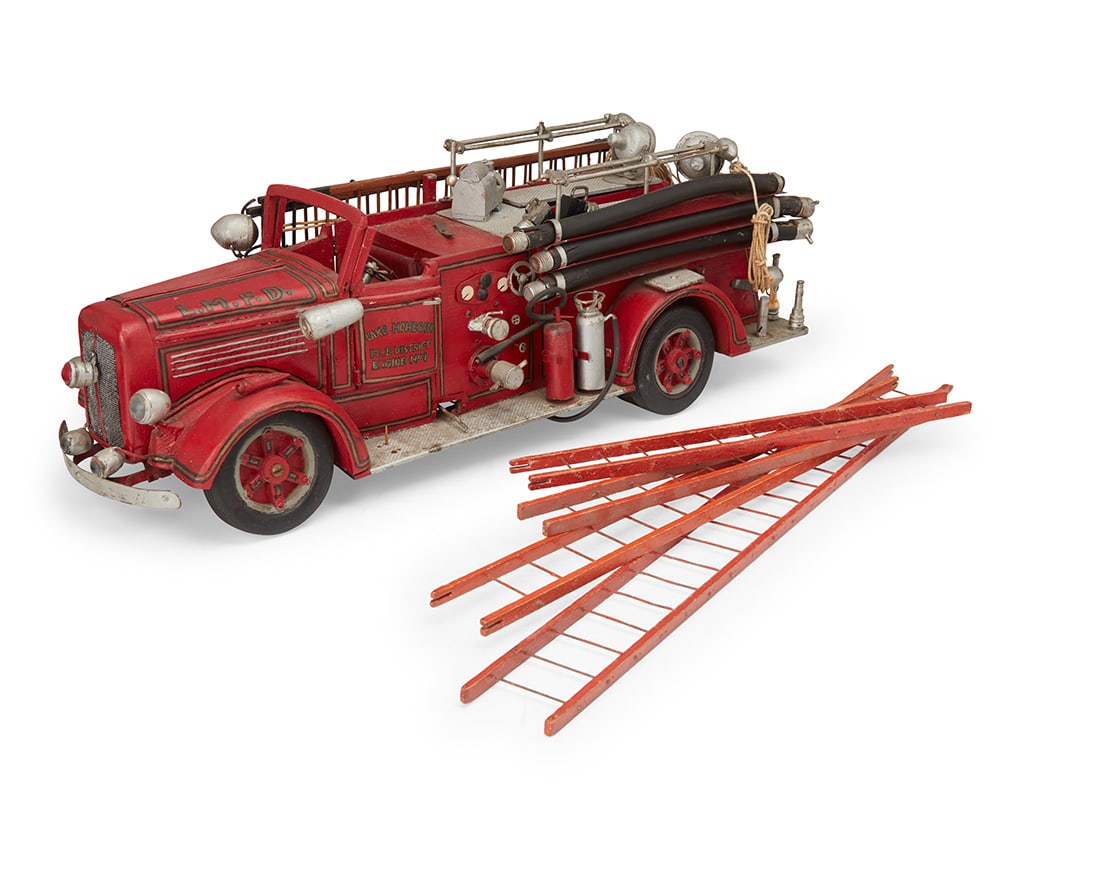 A vintage hook and ladder fire truck toy (1 of 7)