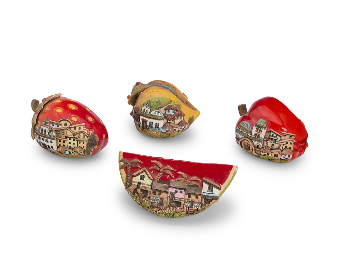 Four glazed art pottery fruits: Four glazed art pottery fruits 2000 One signed and dated: A CARRERA Each painted with city tableaus in relief on a fruit, comprising a strawberry, a watermelon, a bell pepper, and a peach or mango 4