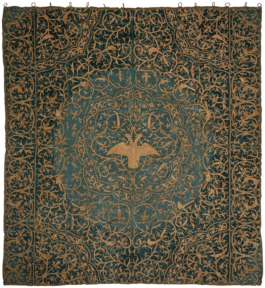 A gilt metal thread embroidered green velvet panel: A gilt metal thread embroidered green velvet panel 18th/19th century A large heavy green velvet hanging with elaborate raised gilt metal thread and corded embroidery featuring allover twined foliate