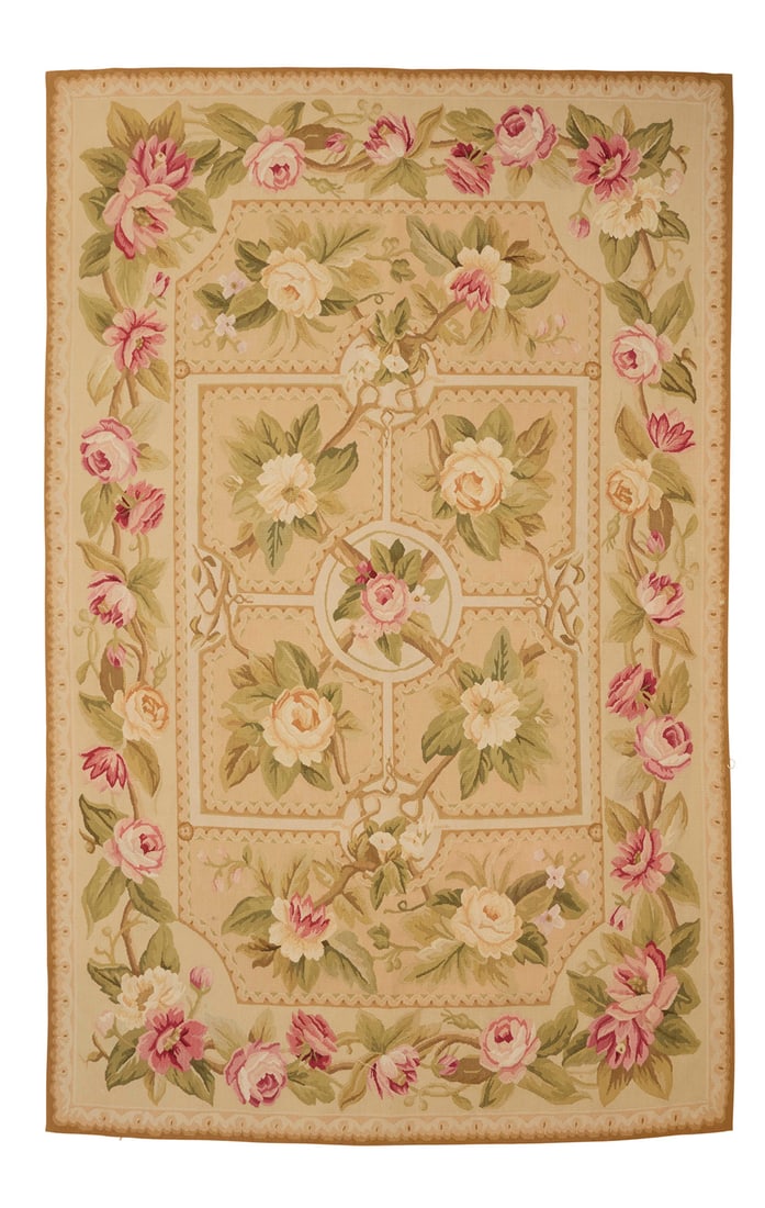An Aubusson floral area rug: An Aubusson floral area rug Early/mid-20th century A polychrome rectangular flat weave wool needlepoint style tapestry rug featuring a central geometric 'parterre' motif with floral branches and fine