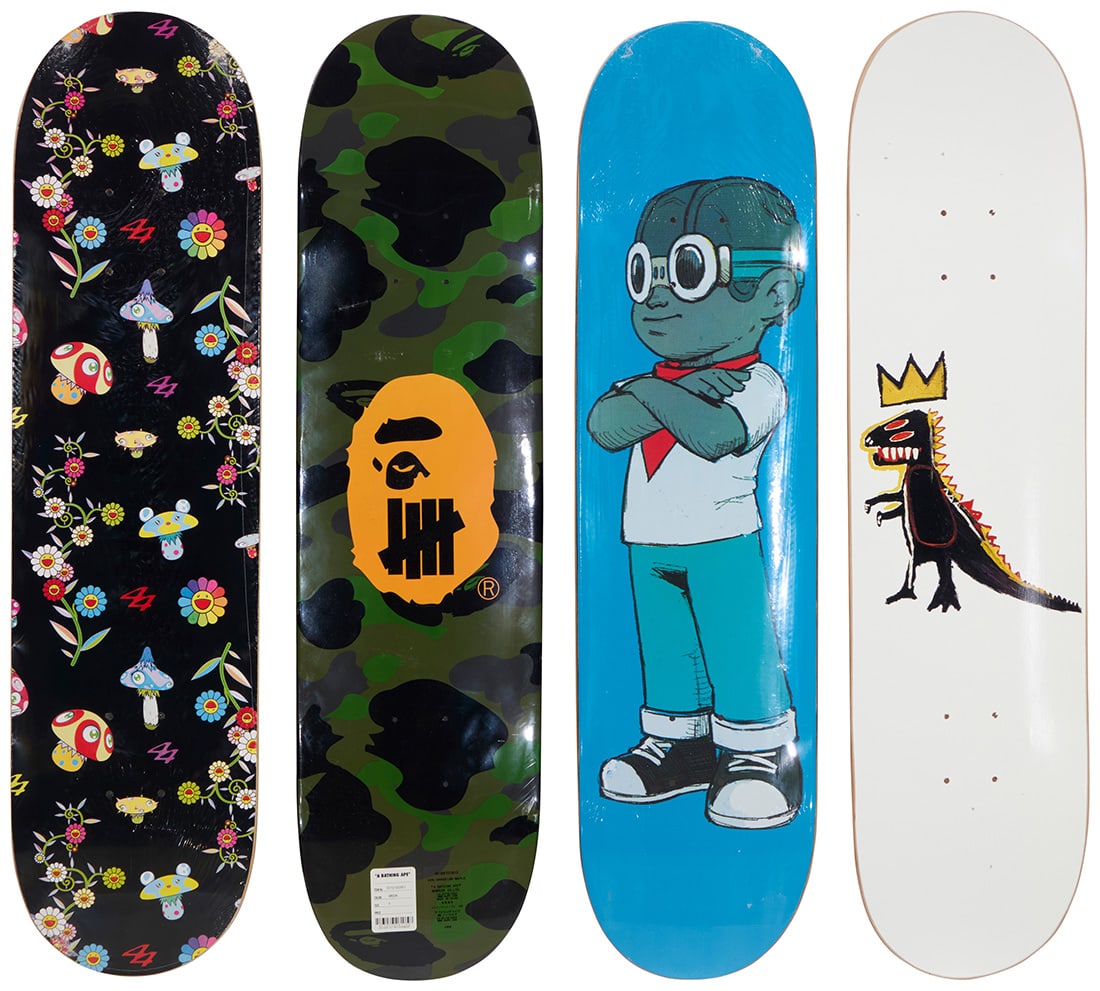 Four skateboard decks (1 of 3)