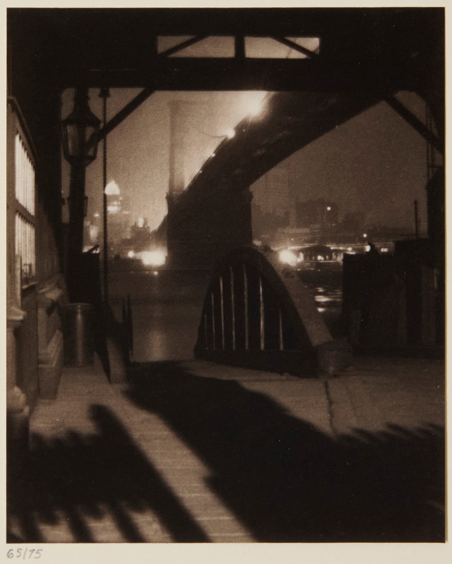 Karl Struss (1886-1981), "Brooklyn Bridge from Ferry Slip, Evening," 1912, from "Karl Struss: A: Karl Struss (1886-1981) "Brooklyn Bridge from Ferry Slip, Evening," 1912, from "Karl Struss: A Portfolio," 1909-29 Platinum print on paper hinged to an embossed board mount, as issued Edition: 65/75