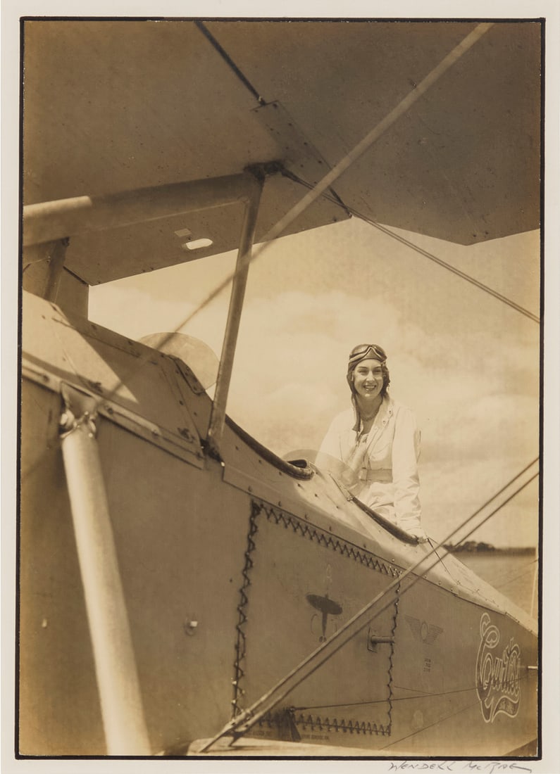 Wendell MacRae (1896-1980), "Ms. Seversky's First Solo [Flight]," circa 1931: Wendell MacRae (1896-1980) "Ms. Seversky's First Solo [Flight]," circa 1931 Photograph in sepia on paper Signed in pencil on the mount directly below the image, at right: Wendell McRae [sic]; titled