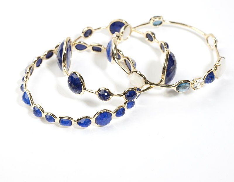 A group of three stone & gold bangles, Ippolita: Signed Ippolita,18K gold ''Lollipop'' bangles set with colorless, lapis and mother-of-pearl doublet faceted stones, size 7 3/4'', 3 pcs, est: $1500/2000