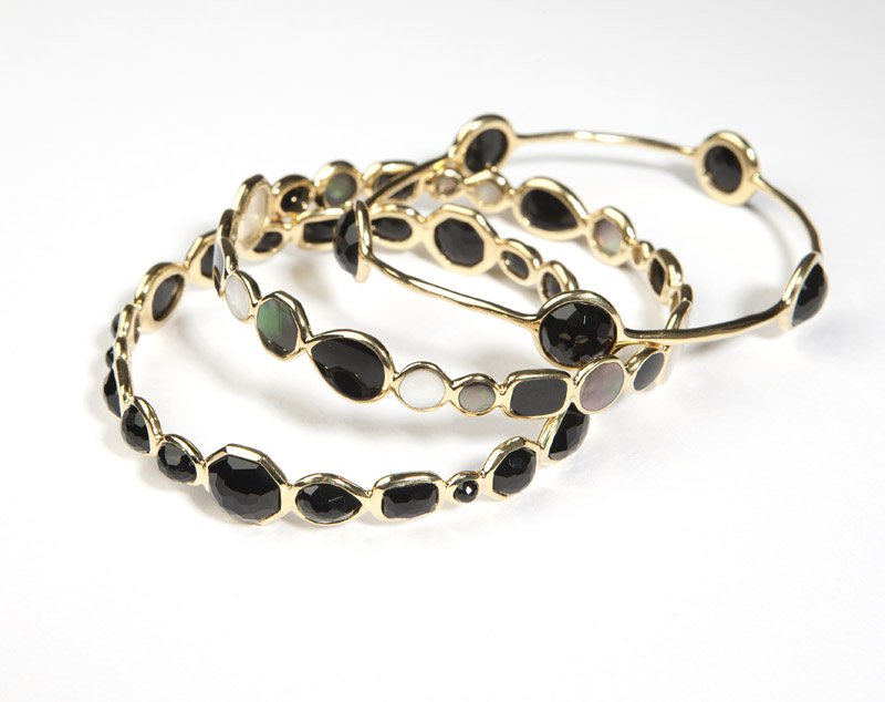 A group of three stone and gold bangles, Ippolita: Signed Ippolita, three 18K gold ''Lollipop'' bangles set with black onyx and mother-of-pearl, size 7 3/4'', 3 pcs, est: $1000/1500