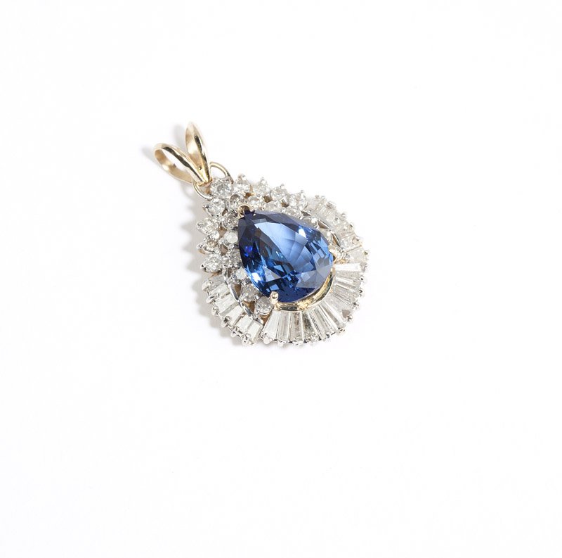 A tanzanite, diamond and gold pendant